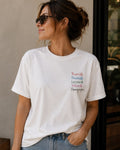 Camiseta branca com estampa colorida Rivotril Champagne no peito esquerdo